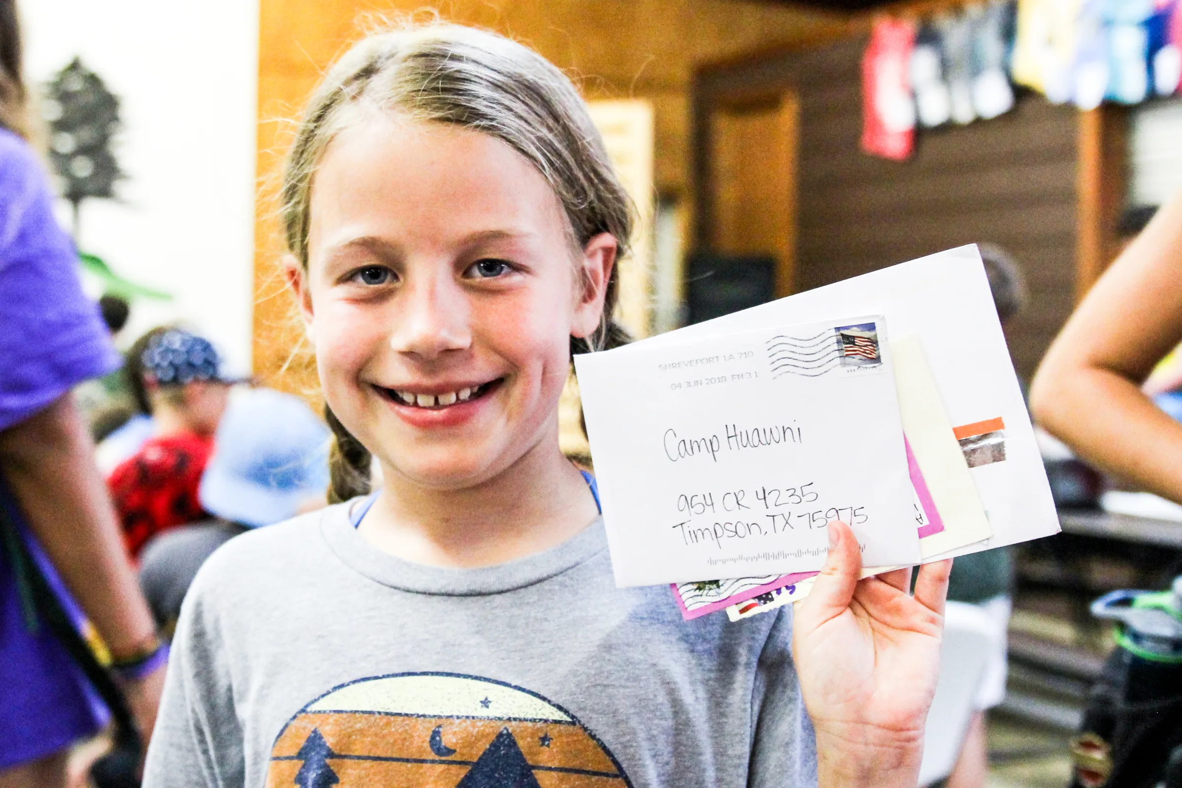 Campers collecting letters and packages at mail call at Camp Huawni